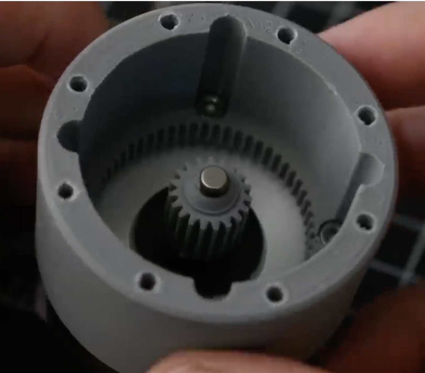 Inside the printed housing: the sun pinion on the servo shaft and the ring gear of the planetary stage